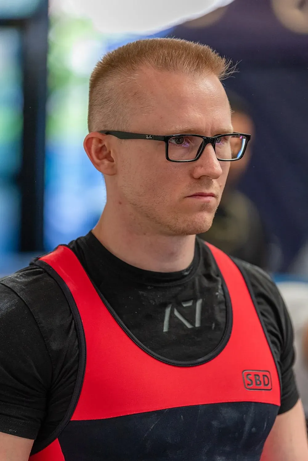 Close-up of Andrew in his singlet, looking serious as he gets ready to lift