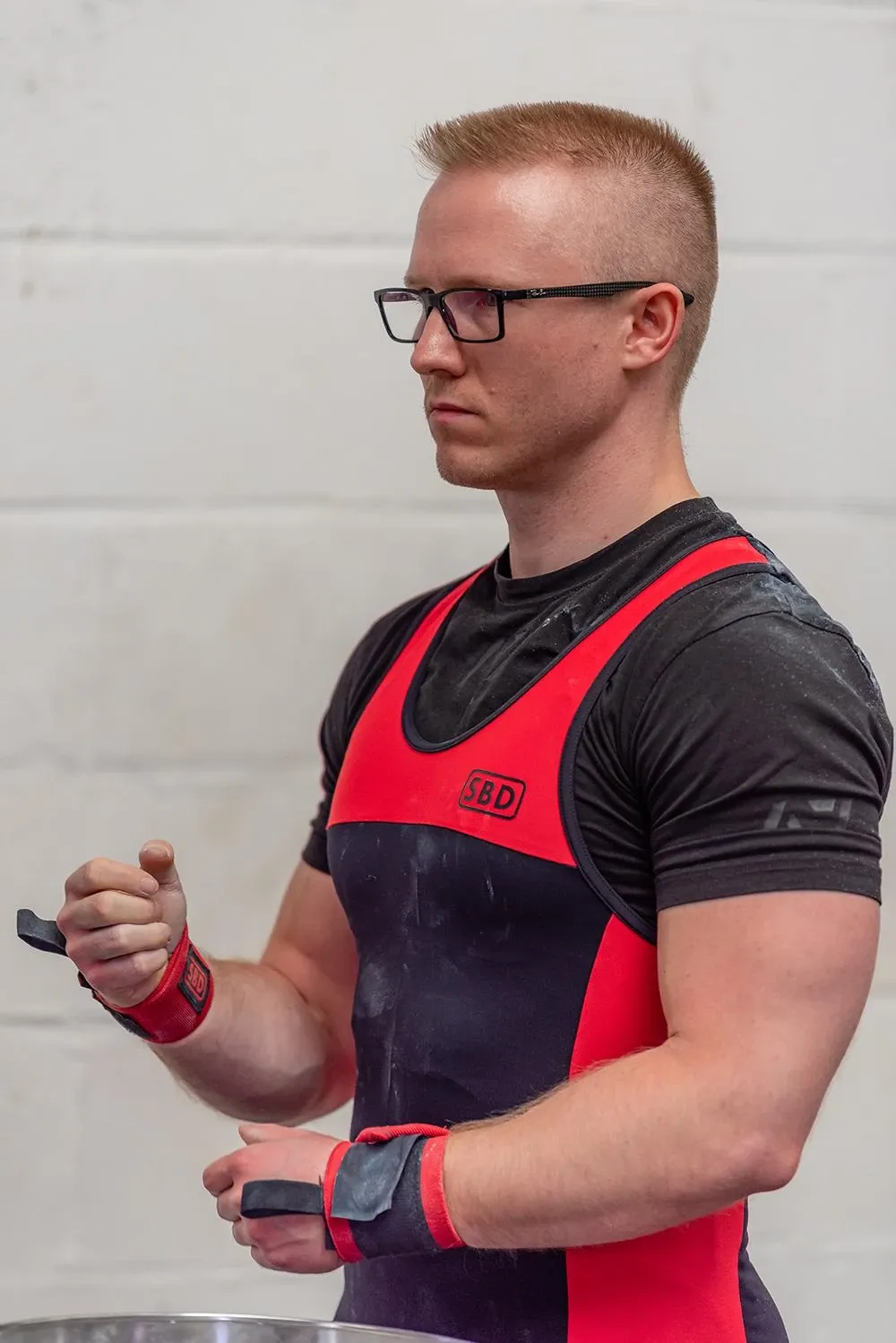 Andrew fastening his wrist wraps