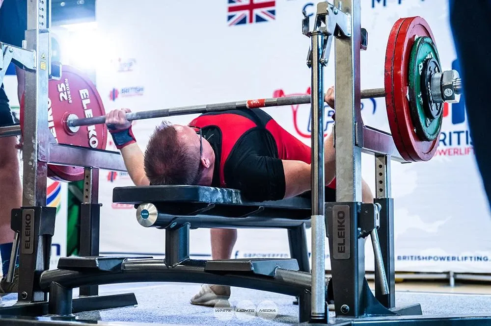 Andrew with the 150 kg bar lowered to his chest