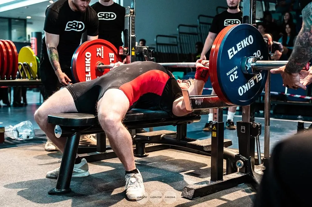 The 165 kg bar on Andrew’s chest