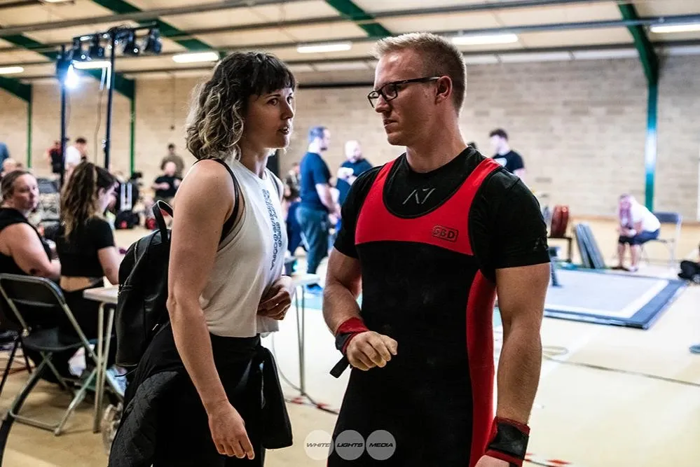 Aimee Spinks and Andrew talking strategy before the third attempt: should he go for 170 kg?