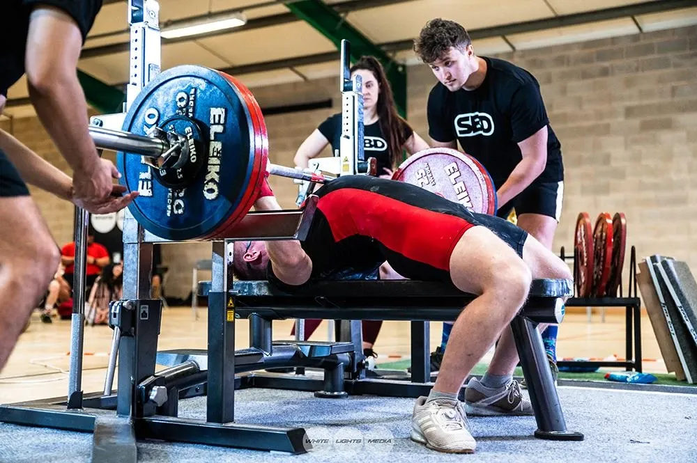 The 170 kg bar touching Andrew’s chest