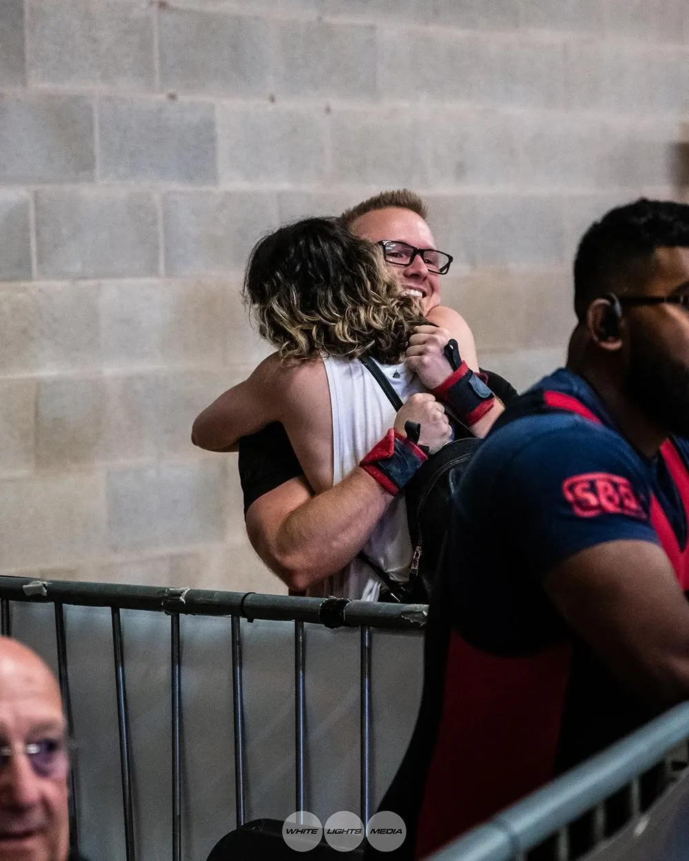 Aimee and Andrew hugging at the barrier to celebrate the win