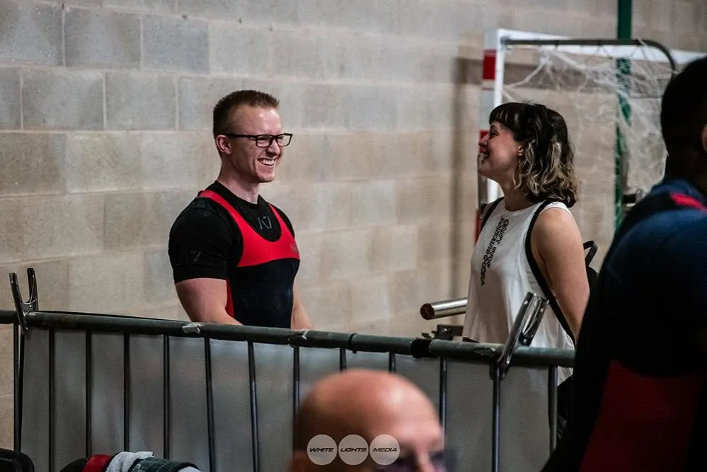 Andrew and Aimee smiling at the barrier after the competition