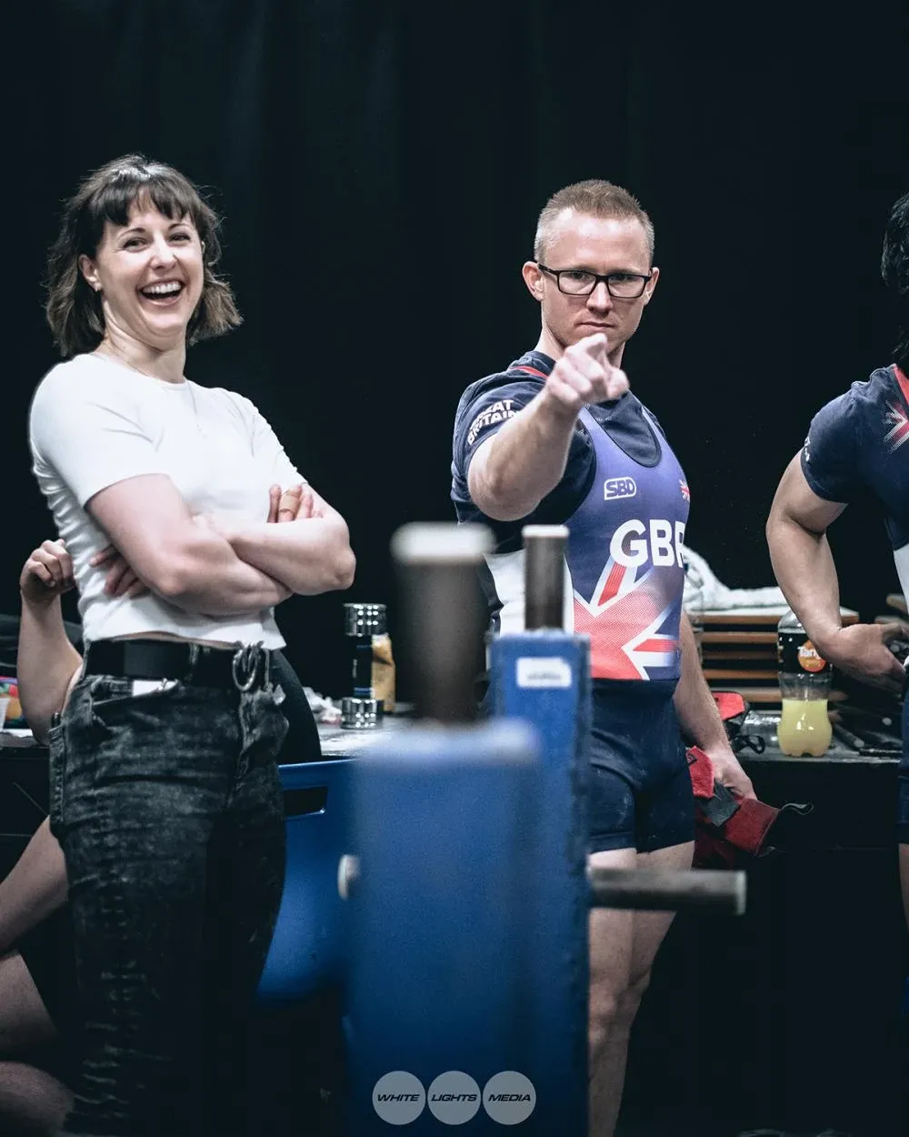 Andrew messing around, pointing at the camera for a joke, while Aimee laughs beside him