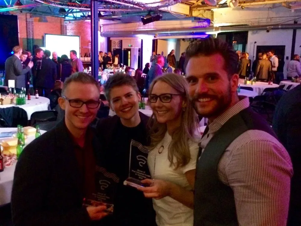 Andrew and Faye Pressly holding their glass Silicon Canal trophies, with Jodie and Ben Cook, at the awards venue