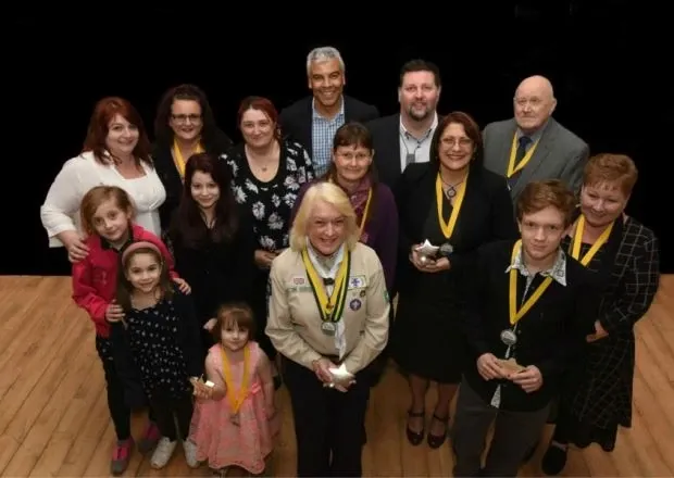 Winners of the local Star Awards posing with their medals and trophies; Jacquie is on the far right