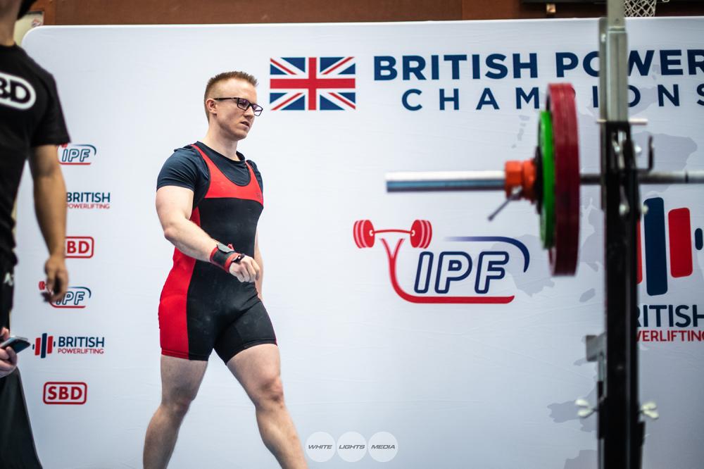 Andrew walks onto the podium at the IPF British Powerlifting Bench Championships
